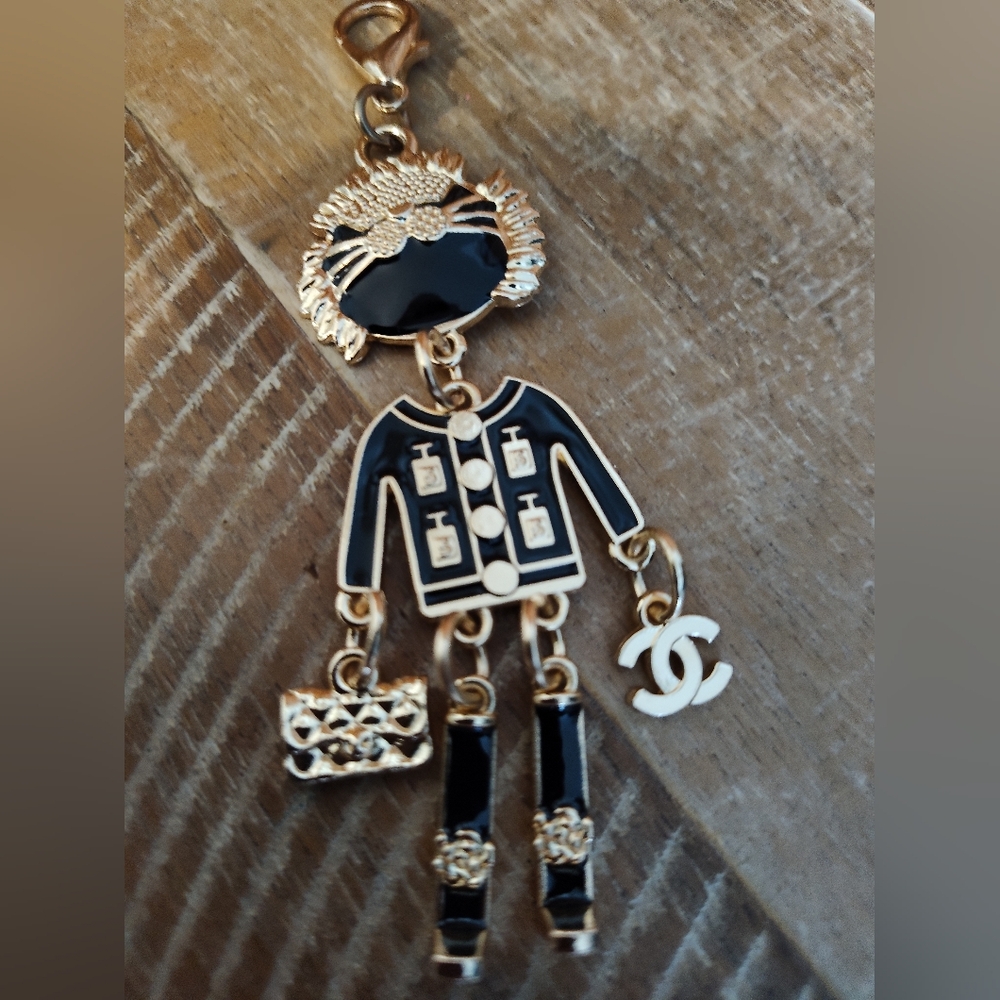 Articulated Gold And Black color Fashion Key Ring/Charm